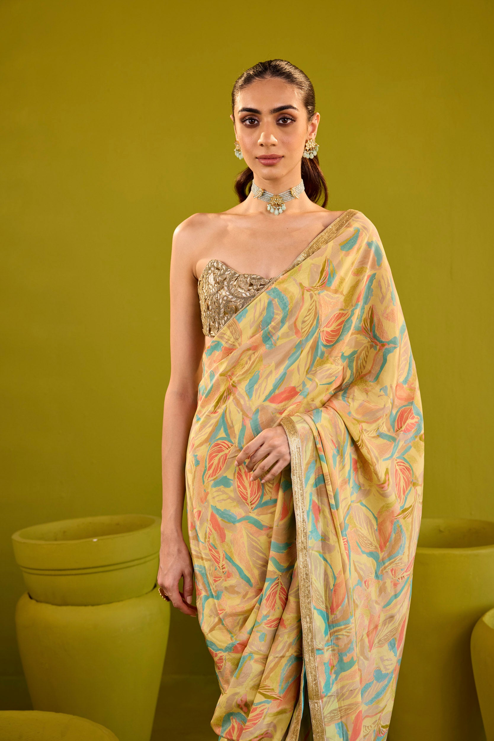 Kashish Yellow Crepe Saree With Gold Embroidered Strapless Blouse